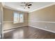 Bedroom features a ceiling fan and large window at 21 Bridal Falls Ct, Las Vegas, NV 89148