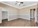 Neutral bedroom with wood floors and white trim, ready for personalization at 21 Bridal Falls Ct, Las Vegas, NV 89148