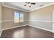 Bedroom featuring neutral colors, crown molding, wood-like floors, and a window view at 21 Bridal Falls Ct, Las Vegas, NV 89148