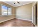 Bright bedroom featuring wood floors and a large window offering natural light at 21 Bridal Falls Ct, Las Vegas, NV 89148