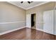 Bedroom with wood floors, closet, and a doorway to ensuite bathroom at 21 Bridal Falls Ct, Las Vegas, NV 89148