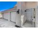 Close-up view of the front door, three-car garage, and gated entrance to the home at 21 Bridal Falls Ct, Las Vegas, NV 89148