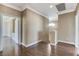 Hallway with wood floors and multiple entryways at 21 Bridal Falls Ct, Las Vegas, NV 89148