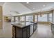 Open concept featuring a kitchen island with sink and stainless steel dishwasher at 21 Bridal Falls Ct, Las Vegas, NV 89148