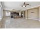 Open-concept living area with kitchen island, tile floors, and ample natural light at 21 Bridal Falls Ct, Las Vegas, NV 89148