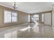 Spacious living room with tile flooring, large windows, and natural light at 21 Bridal Falls Ct, Las Vegas, NV 89148