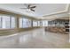 Bright and airy living room with tile flooring and view of kitchen at 21 Bridal Falls Ct, Las Vegas, NV 89148