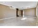 Bright living room with tile flooring and staircase to the second floor at 21 Bridal Falls Ct, Las Vegas, NV 89148