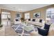 Bright living room with modern furnishings and a large window, perfect for entertaining at 21 Bridal Falls Ct, Las Vegas, NV 89148