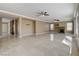 Expansive living room featuring tile flooring, staircase, and a cozy fireplace at 21 Bridal Falls Ct, Las Vegas, NV 89148