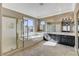 Large main bathroom with dual sinks, soaking tub, and separate shower at 21 Bridal Falls Ct, Las Vegas, NV 89148