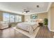 Spacious main bedroom featuring large windows and stylish furnishings, creating a peaceful retreat at 21 Bridal Falls Ct, Las Vegas, NV 89148