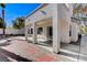 Outdoor patio with white pillars and a brick-paved design, ideal for backyard relaxation at 21 Bridal Falls Ct, Las Vegas, NV 89148