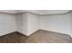 Spacious walk-in closet with wood-like floors and white walls with wood racks at 21 Bridal Falls Ct, Las Vegas, NV 89148