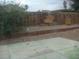 View of a fenced backyard with a concrete patio at 224 S Wallace Dr, Las Vegas, NV 89107