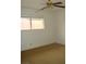 Bedroom featuring a ceiling fan and a window at 224 S Wallace Dr, Las Vegas, NV 89107