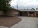 Single-story home with a brick and striped facade, complemented by a driveway and front yard at 224 S Wallace Dr, Las Vegas, NV 89107