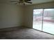 Neutral living area featuring a sliding glass door to the outside at 224 S Wallace Dr, Las Vegas, NV 89107