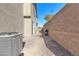 View of narrow backyard area with rocks and fencing at 2300 Trasimeno Pl, Henderson, NV 89044