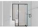 Modern bathroom features a frameless glass shower with black trim and chrome hardware at 2300 Trasimeno Pl, Henderson, NV 89044