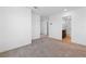 A bright bedroom with neutral walls and soft carpet is connected to a bathroom at 2300 Trasimeno Pl, Henderson, NV 89044