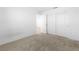 Empty bedroom with neutral carpet and paint and closet at 2300 Trasimeno Pl, Henderson, NV 89044