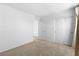 Bedroom featuring neutral walls, carpet, two closets and white doors at 2300 Trasimeno Pl, Henderson, NV 89044