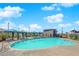 Community pool area with cabanas, lounge chairs, and well-maintained landscaping at 2300 Trasimeno Pl, Henderson, NV 89044