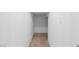 A small hallway with carpeted floors and white walls at 2300 Trasimeno Pl, Henderson, NV 89044