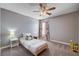 Bedroom showcasing a single bed, carpeted floor, and a ceiling fan for added comfort at 262 Calvino Ave, Las Vegas, NV 89183