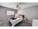 Bedroom features neutral walls, a bed with white bedding and a ceiling fan at 262 Calvino Ave, Las Vegas, NV 89183