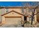 Charming two-story home features a tile roof and a two-car garage at 262 Calvino Ave, Las Vegas, NV 89183