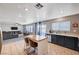 Open-concept kitchen featuring a central island, stainless steel appliances, and access to the living room at 262 Calvino Ave, Las Vegas, NV 89183