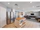 Open-concept kitchen with stainless steel appliances and a center island connected to the living area at 262 Calvino Ave, Las Vegas, NV 89183