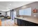 Bright kitchen area with stainless steel dishwasher, faucet and a view into the adjacent living space at 262 Calvino Ave, Las Vegas, NV 89183