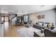 Open-concept living room with tile floors, gray walls, and comfortable seating arrangement at 262 Calvino Ave, Las Vegas, NV 89183