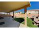 View of covered patio with synthetic grass and seating at 262 Calvino Ave, Las Vegas, NV 89183