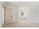 Light-filled bedroom with neutral carpet, window, and white trim at 2632 Cathedral Ln, Las Vegas, NV 89108