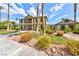 Well-manicured clubhouse exterior with vibrant landscaping, providing an inviting atmosphere at 2632 Cathedral Ln, Las Vegas, NV 89108