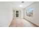 Bright room featuring new flooring, a window with neighborhood views, and a glass-paneled door at 2632 Cathedral Ln, Las Vegas, NV 89108