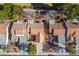 Aerial view of a neighborhood showcasing many homes with desert landscaping and tile roofs at 2636 Highvale Dr, Las Vegas, NV 89134