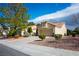 Charming single story home with a tile roof, desert landscaping and an attached two-car garage at 2636 Highvale Dr, Las Vegas, NV 89134