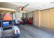 Organized garage space with built-in cabinets and a golf cart at 2636 Highvale Dr, Las Vegas, NV 89134