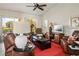 Cozy living room featuring comfortable seating, a ceiling fan, and a view to the outside at 2636 Highvale Dr, Las Vegas, NV 89134