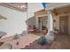 Charming front patio with seating area and desert landscaping at 2636 Highvale Dr, Las Vegas, NV 89134