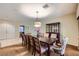 Dining room with seating for ten, a wooden hutch, and neutral decor for a cozy and inviting atmosphere at 2783 Cherrydale Falls Dr, Henderson, NV 89052