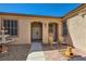 Inviting front entrance with seating area, decorative fountain and unique sunburst gate at 2783 Cherrydale Falls Dr, Henderson, NV 89052