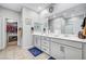 Stylish bathroom featuring dual sinks, ample counter space, and modern fixtures at 3026 English Palmer Rd, North Las Vegas, NV 89086