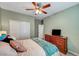 Cozy bedroom features a double door closet, dresser, and calming color palette at 3026 English Palmer Rd, North Las Vegas, NV 89086