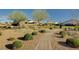 Landscaped community park with walking path and playground equipment on a sunny day at 3026 English Palmer Rd, North Las Vegas, NV 89086